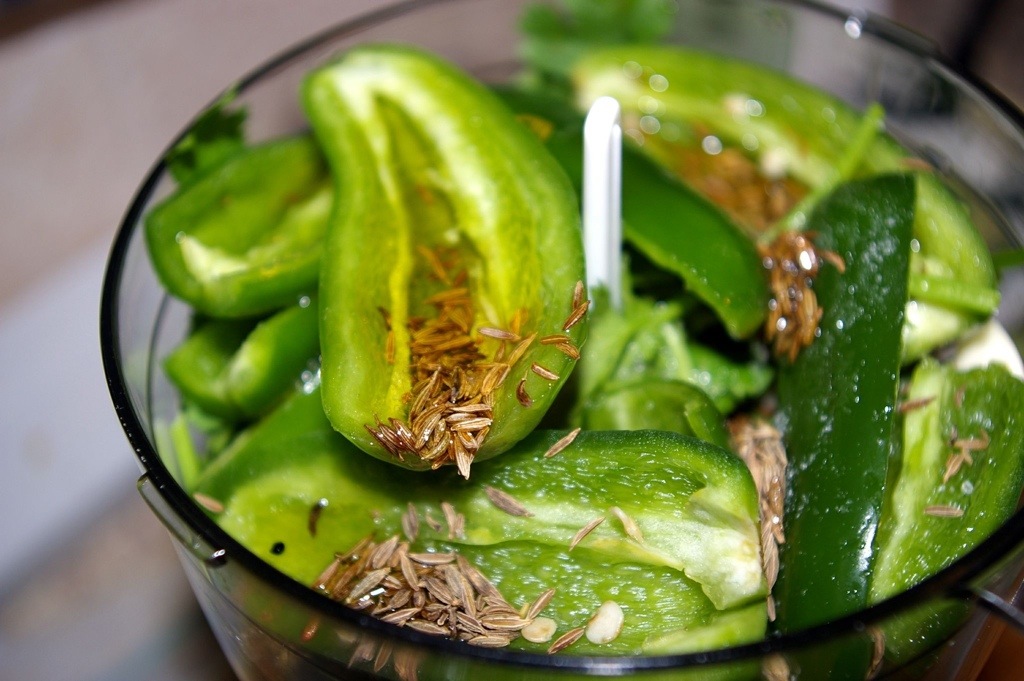 Peppers and cumin seed in a blender