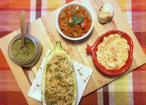 Israeli appetizers: Matbucha, hummus, eggplant dip and zataar.